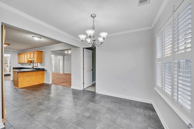 Welcome to this spacious 4-bedroom, 2-bath home in the highly on The International City Golf Course in Georgia - for sale on GolfHomes.com, golf home, golf lot