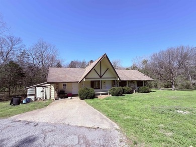4-bedroom, 3-bath home on approximately 0.69 acres with a wet on Cherokee Village North Course in Arkansas - for sale on GolfHomes.com, golf home, golf lot