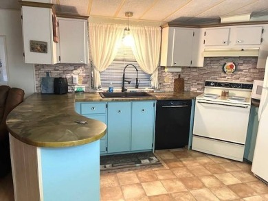 Welcome to your perfect seasonal escape! This 2-bedroom on Crystal Lake Club in Florida - for sale on GolfHomes.com, golf home, golf lot