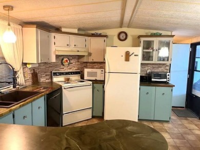 Welcome to your perfect seasonal escape! This 2-bedroom on Crystal Lake Club in Florida - for sale on GolfHomes.com, golf home, golf lot