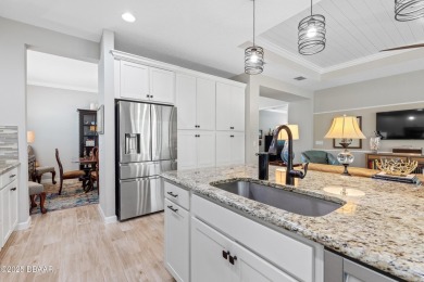 Welcome to Perfection in Paradise! This amazing Parrot model is on LPGA International Golf Course in Florida - for sale on GolfHomes.com, golf home, golf lot