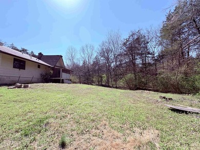 4-bedroom, 3-bath home on approximately 0.69 acres with a wet on Cherokee Village North Course in Arkansas - for sale on GolfHomes.com, golf home, golf lot