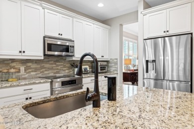 Welcome to Perfection in Paradise! This amazing Parrot model is on LPGA International Golf Course in Florida - for sale on GolfHomes.com, golf home, golf lot
