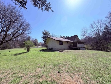 4-bedroom, 3-bath home on approximately 0.69 acres with a wet on Cherokee Village North Course in Arkansas - for sale on GolfHomes.com, golf home, golf lot