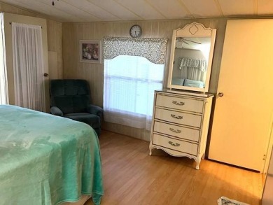 Welcome to your perfect seasonal escape! This 2-bedroom on Crystal Lake Club in Florida - for sale on GolfHomes.com, golf home, golf lot