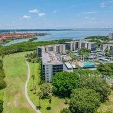 A View to Die For!  Discover the perfect blend of luxury and on Cove Cay Country Club in Florida - for sale on GolfHomes.com, golf home, golf lot