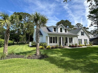 If you're looking for a light, bright, open, move-in ready home on Wedgefield Plantation Golf Club in South Carolina - for sale on GolfHomes.com, golf home, golf lot