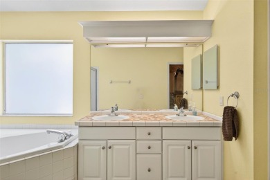 Welcome to 17728 Long Ridge Road, a beautifully maintained on Hunters Green Country Club in Florida - for sale on GolfHomes.com, golf home, golf lot