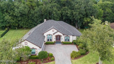 Elegant 4BR/3BA Gated with Guarded on .97 acre! A Beautifully on Country Club of Orange Park in Florida - for sale on GolfHomes.com, golf home, golf lot