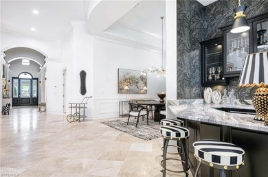 Nestled within the prestigious Pelican Marsh, this recently on Pelican Marsh Golf Club in Florida - for sale on GolfHomes.com, golf home, golf lot