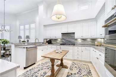 Nestled within the prestigious Pelican Marsh, this recently on Pelican Marsh Golf Club in Florida - for sale on GolfHomes.com, golf home, golf lot