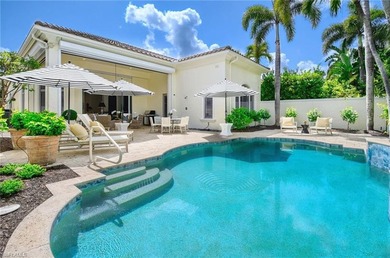 Nestled within the prestigious Pelican Marsh, this recently on Pelican Marsh Golf Club in Florida - for sale on GolfHomes.com, golf home, golf lot