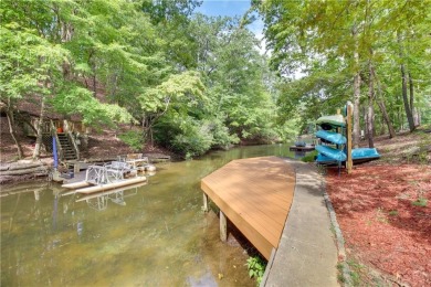 PRICE IMPROVEMENT - WATERFRONT RETREAT - located in the Lake on The Highlands Course at Lake Arrowhead in Georgia - for sale on GolfHomes.com, golf home, golf lot