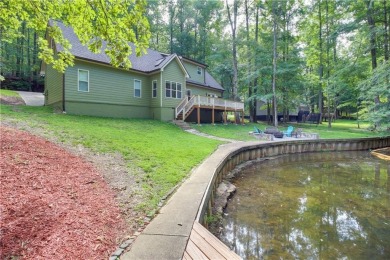 PRICE IMPROVEMENT - WATERFRONT RETREAT - located in the Lake on The Highlands Course at Lake Arrowhead in Georgia - for sale on GolfHomes.com, golf home, golf lot