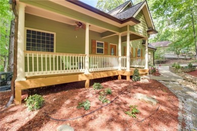PRICE IMPROVEMENT - WATERFRONT RETREAT - located in the Lake on The Highlands Course at Lake Arrowhead in Georgia - for sale on GolfHomes.com, golf home, golf lot