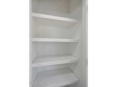 This thoughtfully designed home offers quality construction on Patrick Farms Golf Club in Mississippi - for sale on GolfHomes.com, golf home, golf lot