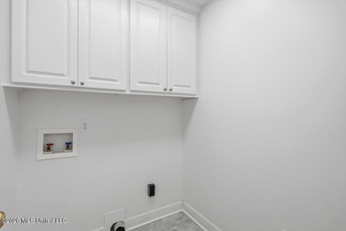 This thoughtfully designed home offers quality construction on Patrick Farms Golf Club in Mississippi - for sale on GolfHomes.com, golf home, golf lot