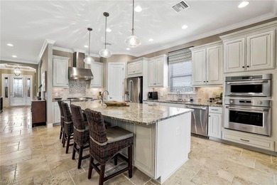 Enjoy captivating lake views from this impeccably turnkey with on The Rookery At Marco in Florida - for sale on GolfHomes.com, golf home, golf lot