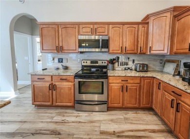 Discover Privacy and luxury in this 4 bedroom/ 3 full bath (plus on The Grand Club - Pine Lakes Course in Florida - for sale on GolfHomes.com, golf home, golf lot