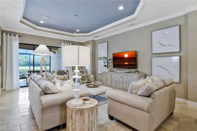 Enjoy captivating lake views from this impeccably turnkey with on The Rookery At Marco in Florida - for sale on GolfHomes.com, golf home, golf lot