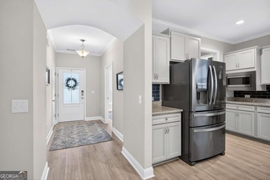 Welcome to this stunning coastal retreat in prestigious Savannah on Savannah Quarters Country Club in Georgia - for sale on GolfHomes.com, golf home, golf lot