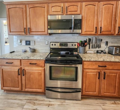 Discover Privacy and luxury in this 4 bedroom/ 3 full bath (plus on The Grand Club - Pine Lakes Course in Florida - for sale on GolfHomes.com, golf home, golf lot