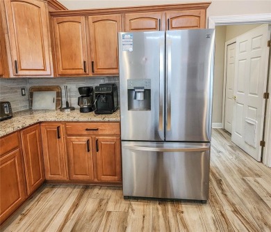 Discover Privacy and luxury in this 4 bedroom/ 3 full bath (plus on The Grand Club - Pine Lakes Course in Florida - for sale on GolfHomes.com, golf home, golf lot