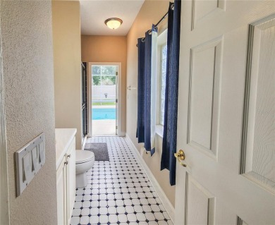 Discover Privacy and luxury in this 4 bedroom/ 3 full bath (plus on The Grand Club - Pine Lakes Course in Florida - for sale on GolfHomes.com, golf home, golf lot