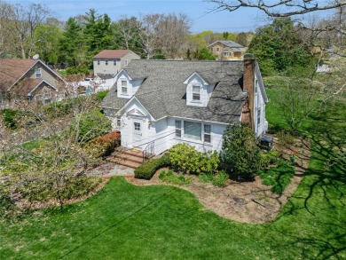 Welcome to 1440 Roanoke Ave, a charming cape-style home nestled on Sandy Pond Golf Course in New York - for sale on GolfHomes.com, golf home, golf lot