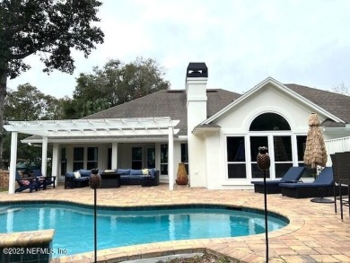 Discover your dream home in the exclusive Queens Harbour Yacht & on Queens Harbour Yacht and Country Club in Florida - for sale on GolfHomes.com, golf home, golf lot
