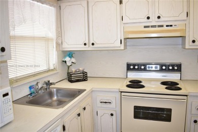 This furnished, turnkey, top floor condo features all new on Sunrise Lakes Phase III in Florida - for sale on GolfHomes.com, golf home, golf lot