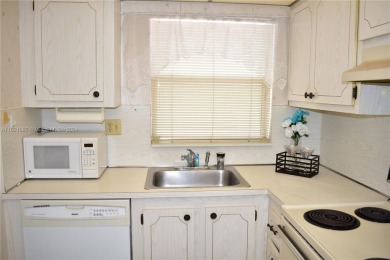 This furnished, turnkey, top floor condo features all new on Sunrise Lakes Phase III in Florida - for sale on GolfHomes.com, golf home, golf lot