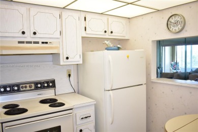 This furnished, turnkey, top floor condo features all new on Sunrise Lakes Phase III in Florida - for sale on GolfHomes.com, golf home, golf lot