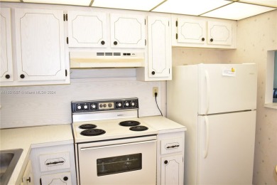 This furnished, turnkey, top floor condo features all new on Sunrise Lakes Phase III in Florida - for sale on GolfHomes.com, golf home, golf lot