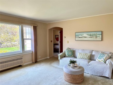 Welcome to 1440 Roanoke Ave, a charming cape-style home nestled on Sandy Pond Golf Course in New York - for sale on GolfHomes.com, golf home, golf lot