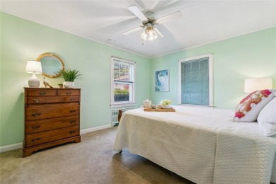 Welcome to 1440 Roanoke Ave, a charming cape-style home nestled on Sandy Pond Golf Course in New York - for sale on GolfHomes.com, golf home, golf lot