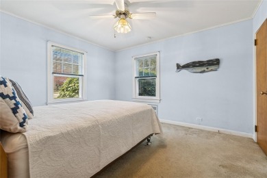 Welcome to 1440 Roanoke Ave, a charming cape-style home nestled on Sandy Pond Golf Course in New York - for sale on GolfHomes.com, golf home, golf lot