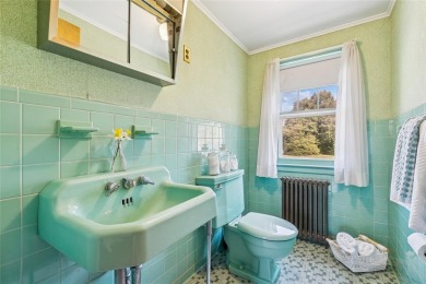 Welcome to 1440 Roanoke Ave, a charming cape-style home nestled on Sandy Pond Golf Course in New York - for sale on GolfHomes.com, golf home, golf lot