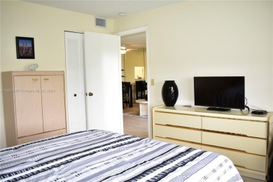 This furnished, turnkey, top floor condo features all new on Sunrise Lakes Phase III in Florida - for sale on GolfHomes.com, golf home, golf lot