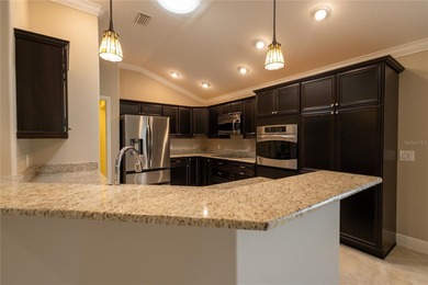 This oversized Lantana waterfront home with rare Water and Golf on Glenview Championship Golf and Country Club in Florida - for sale on GolfHomes.com, golf home, golf lot