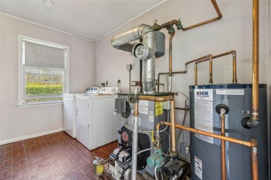 Welcome to 1440 Roanoke Ave, a charming cape-style home nestled on Sandy Pond Golf Course in New York - for sale on GolfHomes.com, golf home, golf lot