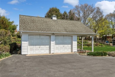 Welcome to 1440 Roanoke Ave, a charming cape-style home nestled on Sandy Pond Golf Course in New York - for sale on GolfHomes.com, golf home, golf lot