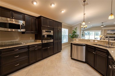 This oversized Lantana waterfront home with rare Water and Golf on Glenview Championship Golf and Country Club in Florida - for sale on GolfHomes.com, golf home, golf lot