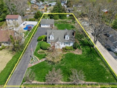 Welcome to 1440 Roanoke Ave, a charming cape-style home nestled on Sandy Pond Golf Course in New York - for sale on GolfHomes.com, golf home, golf lot