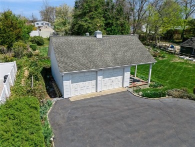 Welcome to 1440 Roanoke Ave, a charming cape-style home nestled on Sandy Pond Golf Course in New York - for sale on GolfHomes.com, golf home, golf lot