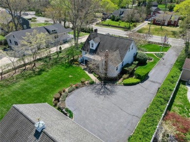 Welcome to 1440 Roanoke Ave, a charming cape-style home nestled on Sandy Pond Golf Course in New York - for sale on GolfHomes.com, golf home, golf lot