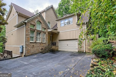 Nestled in the coveted Waterfall at Lake Burton community, this on Waterfall Country Club in Georgia - for sale on GolfHomes.com, golf home, golf lot