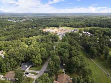 This cozy 3 bedroom/2 bath home features vinyl siding, fenced on Druid Hills Golf Club in Tennessee - for sale on GolfHomes.com, golf home, golf lot