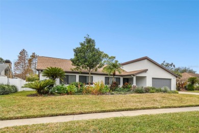 Welcome to your dream home in the exclusive Carrollwood Village on Carrollwood Country Club in Florida - for sale on GolfHomes.com, golf home, golf lot