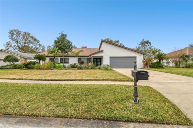 Welcome to your dream home in the exclusive Carrollwood Village on Carrollwood Country Club in Florida - for sale on GolfHomes.com, golf home, golf lot